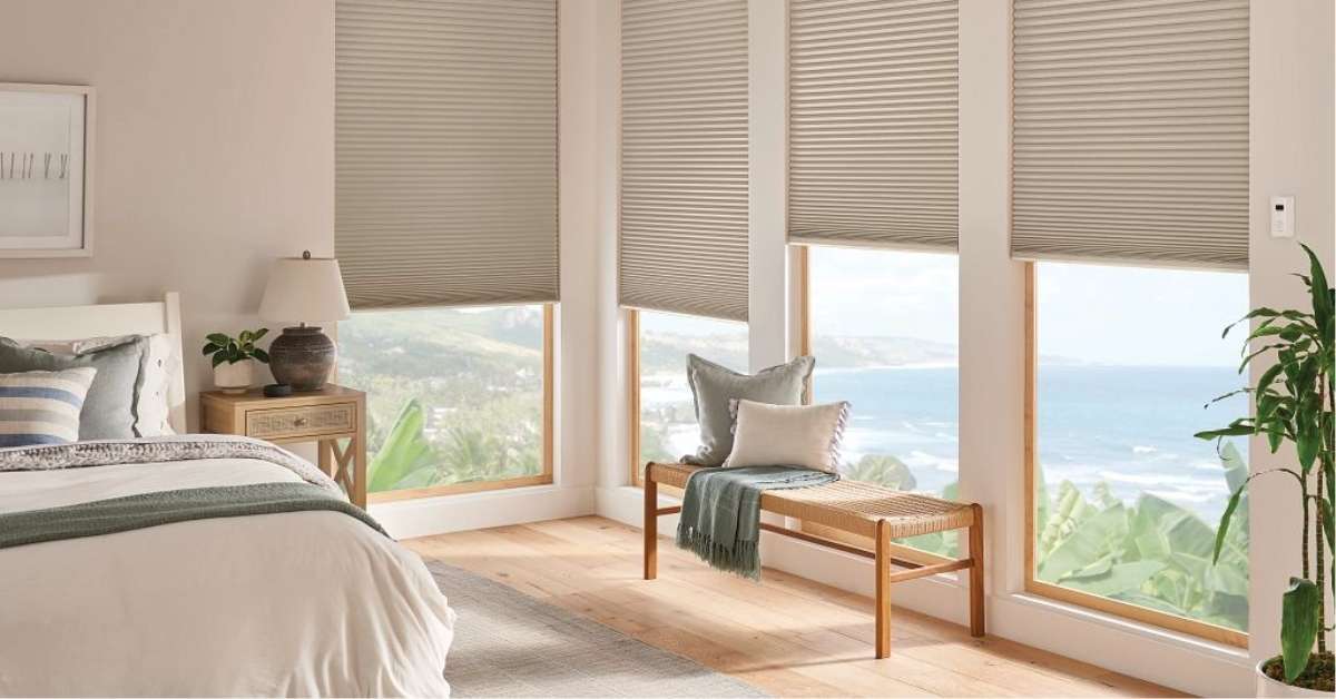 Cellular window treatments enhancing bedroom decor